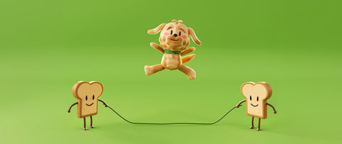 A small dog figure called Flapper jumps in the air between two smiling toast-shaped characters holding a rope, set against a solid green studio background.