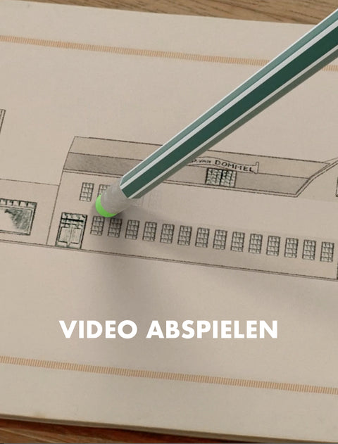 A close-up of a hand-drawn architectural sketch on beige paper, with a green and white striped pencil resting diagonally across it. White text at the bottom reads 'VIDEO ABSPIELEN'.