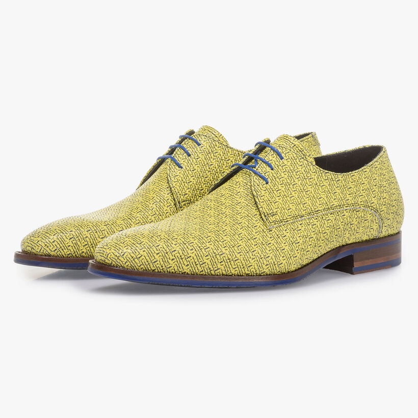 Yellow leather lace shoe with black print