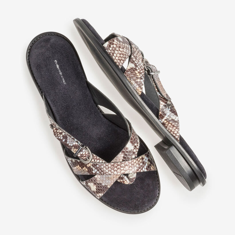 Brown and white leather slipper with snake print