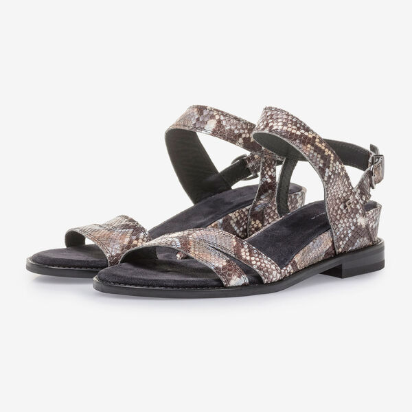 Brown and white leather sandals with snake print