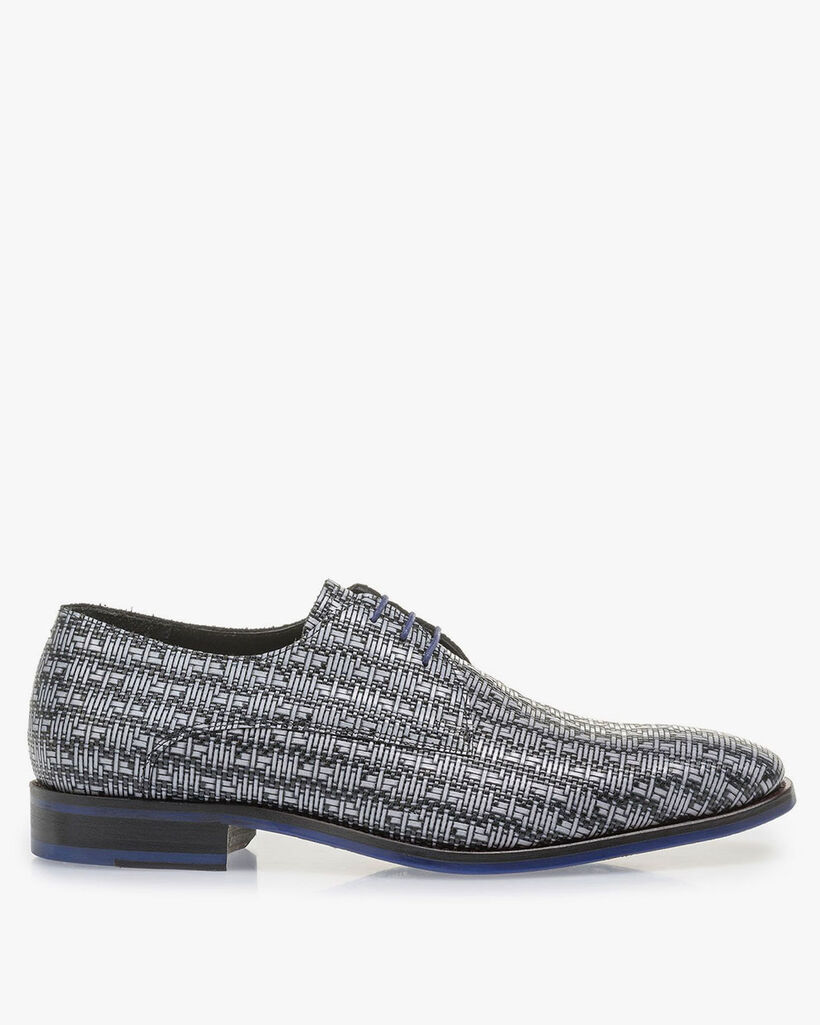 Grey lace shoe with a black graphic print