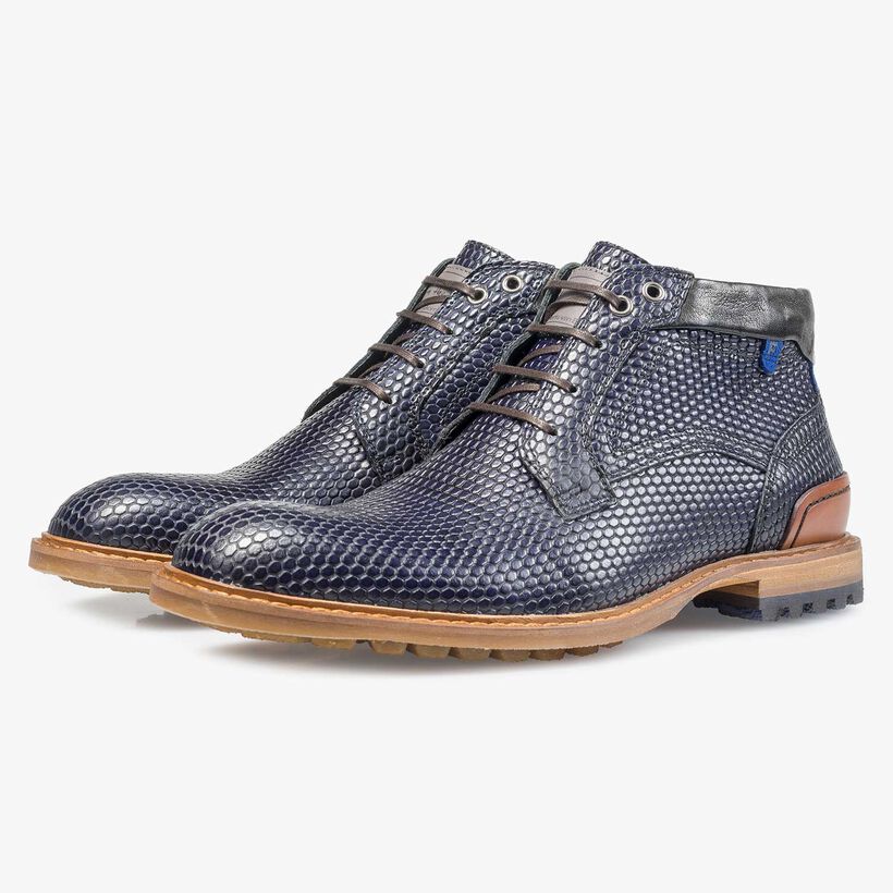 Dark blue leather lace boot with a structural print