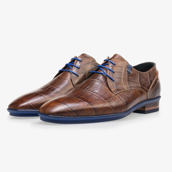 Brown leather lace shoe with a croco print