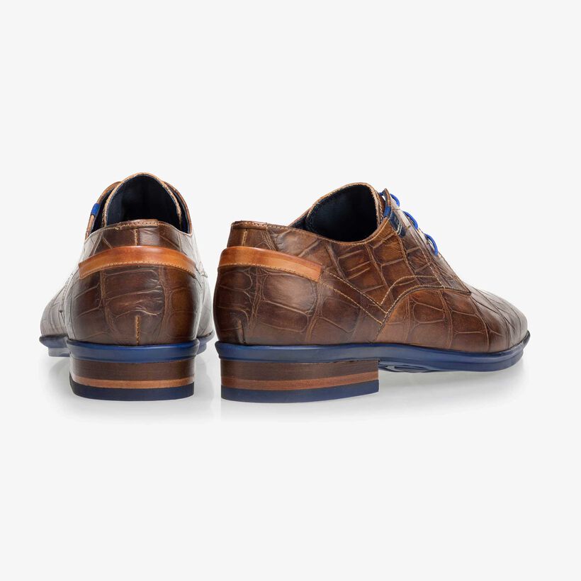 Brown leather lace shoe with a croco print